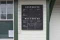 Antique chalk board train schedule at Fort Langley heritage CN railway station