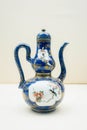 Antique chinese porcelain teapot with a nature theme design