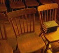 Antique church chairs with hymnals Royalty Free Stock Photo