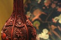 Antique cinnabar vase detail background