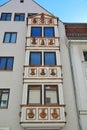 Antique classic building, with intricate details and a white finish in in Augsburg