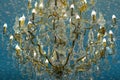 Antique classic chandelier with modern lamps.