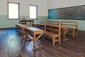 Antique classroom in school with Rows of empty wooden desks Royalty Free Stock Photo