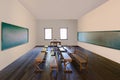 Antique classroom in school with Rows of empty wooden desks Royalty Free Stock Photo