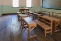 Antique classroom in school with Rows of empty wooden desks Royalty Free Stock Photo