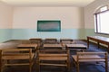 Antique classroom in school with Rows of empty wooden desks