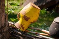 Antique clay jug and pot handmade earthenware on wicker fence in Pyrohiv village, Ukraine