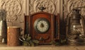 the antique clock on the mantelpiece shows five minutes to midnight. Close-up in a low key, with vintage interior items Royalty Free Stock Photo