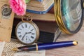 Antique clock on old books and letters background Royalty Free Stock Photo