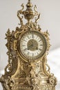 Antique clock photo close up, old bronze clock in gilding, front of bronze fireplace clock, e Royalty Free Stock Photo