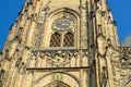 Antique clock on a tower with gold decoration in the center of Prague