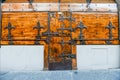 Antique closed door and windows of a shop at Firenze