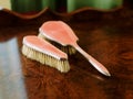 Antique clothes brushes on a wooden table