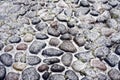 antique cobblestone pavement covered with snow