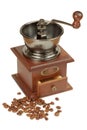 Antique coffee grinder and coffee beans Royalty Free Stock Photo