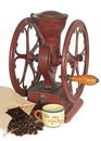 Antique coffee wheel grinder, beans, cup Royalty Free Stock Photo