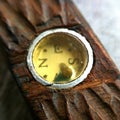 Antique compass encased in a hand carved piece of wood. Royalty Free Stock Photo