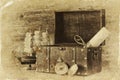 Antique compass, manuscript, old vintage chest on wooden table. black and white style old photo Royalty Free Stock Photo