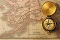 Antique compass over old XIX century map Royalty Free Stock Photo