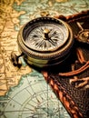 An antique compass placed on a vintage map Royalty Free Stock Photo