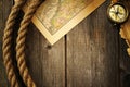 Antique compass and rope over old map Royalty Free Stock Photo