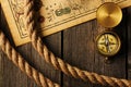 Antique compass and rope over old map Royalty Free Stock Photo
