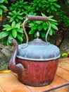 Battered Antique Copper Kettle in Garden