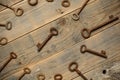 Antique copper keys on old wooden background Royalty Free Stock Photo