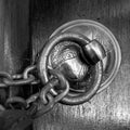 Antique copper ornate door knocker and rusted chain, Eyup Sultan Mosque, Istanbul, Turkey Royalty Free Stock Photo