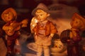 Antique cowboy dolls in wooden showcase shelf