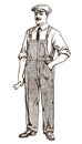 Antique craftsman, mechanic or technician wearing an overall and a cap, holding a wrench