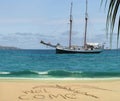 Antique cruise boat & welcome on tropical beach. Royalty Free Stock Photo