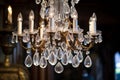 An antique crystal chandelier with dangling prisms