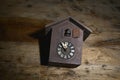 antique cuckoo wall clock on wood background ,time concept image,time concept image