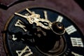 Macro of antique cuckoo wall clock on wood background ,time concept image