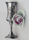 Antique cup of melchior rose. Silver color.