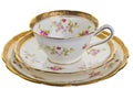Antique cup, saucer and small plate. Royalty Free Stock Photo