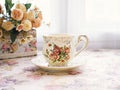 Antique cup of tea with yellow orange rose flowers background ,porcelain teacup vintage style ,old English coffee cup Royalty Free Stock Photo