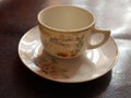 Antique decorated cup and saucer