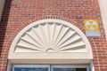 Antique decorative arched lintel on a fallout shelter