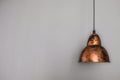 Antique decorative brown bronze shimmer lamp hanging from the ceiling. Grey wall in the background with empty space for text, copy Royalty Free Stock Photo