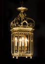 Electric brass hanging antique lantern isolated on black