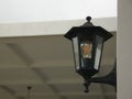 Antique decorative lantern for outdoor lighting made of black metal