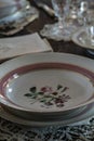 Antique dining setting with china.