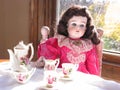 Antique Doll with her Tea Set