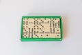 Antique domino game in a green box Royalty Free Stock Photo