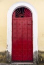 Antique door details in color with shadow, iron, cement, wood