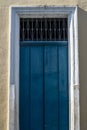 Antique door details in color with shadow, iron, cement, wood
