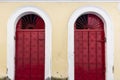 Antique door details in color with shadow, iron, cement, wood