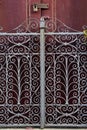 Antique door details in color with shadow, iron, cement, wood